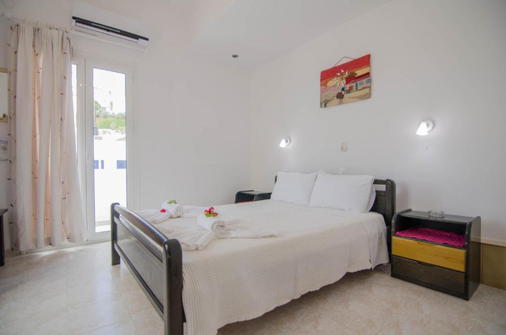 Postel nebo postele na pokoji v ubytování Hotel Delfini