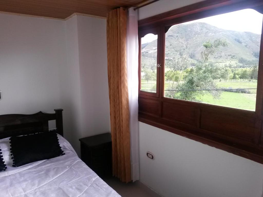 Postel nebo postele na pokoji v ubytování Hospedaje El Mirador