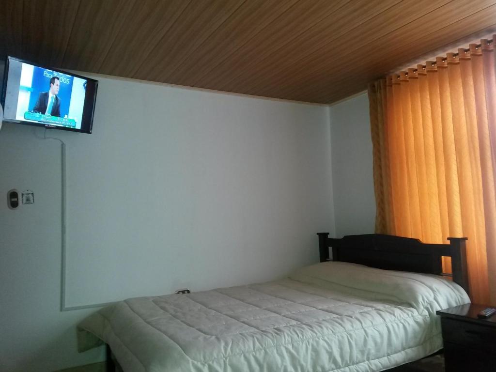 Postel nebo postele na pokoji v ubytování Hospedaje El Mirador