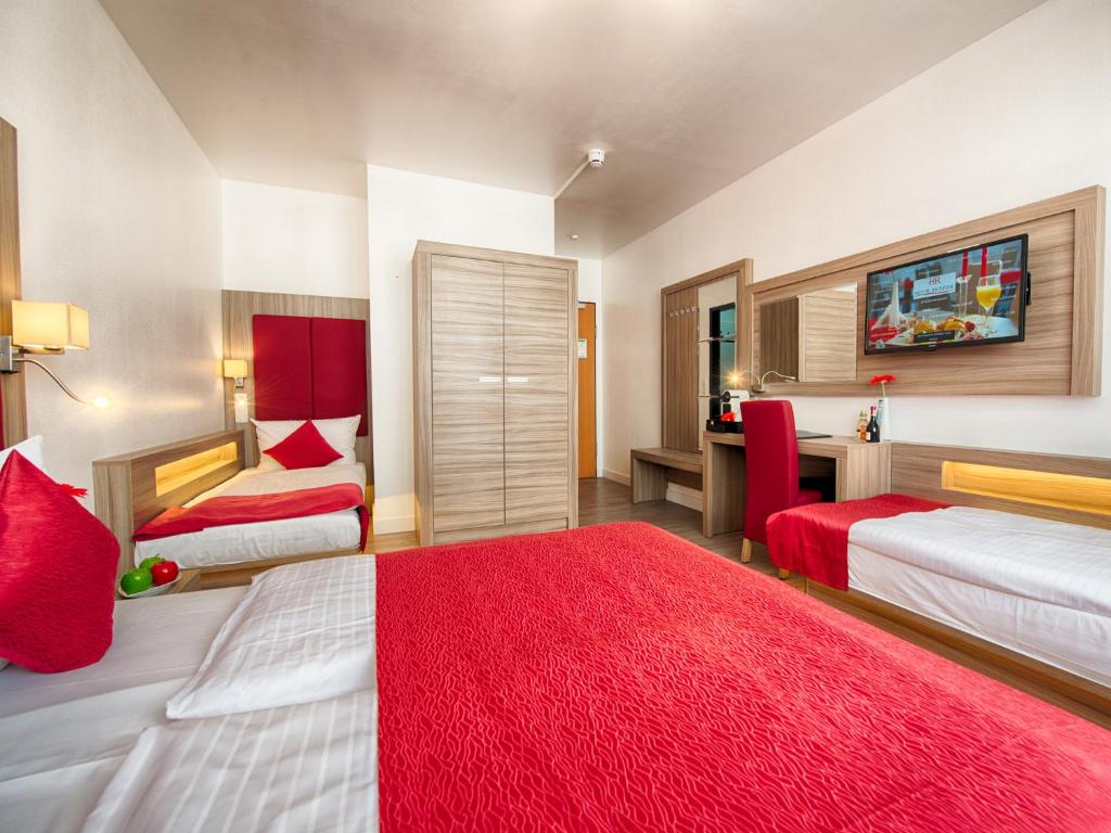 Säng eller sängar i ett rum på Hotel Richter
