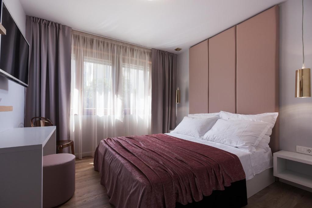Postel nebo postele na pokoji v ubytování Rooms Albachiara