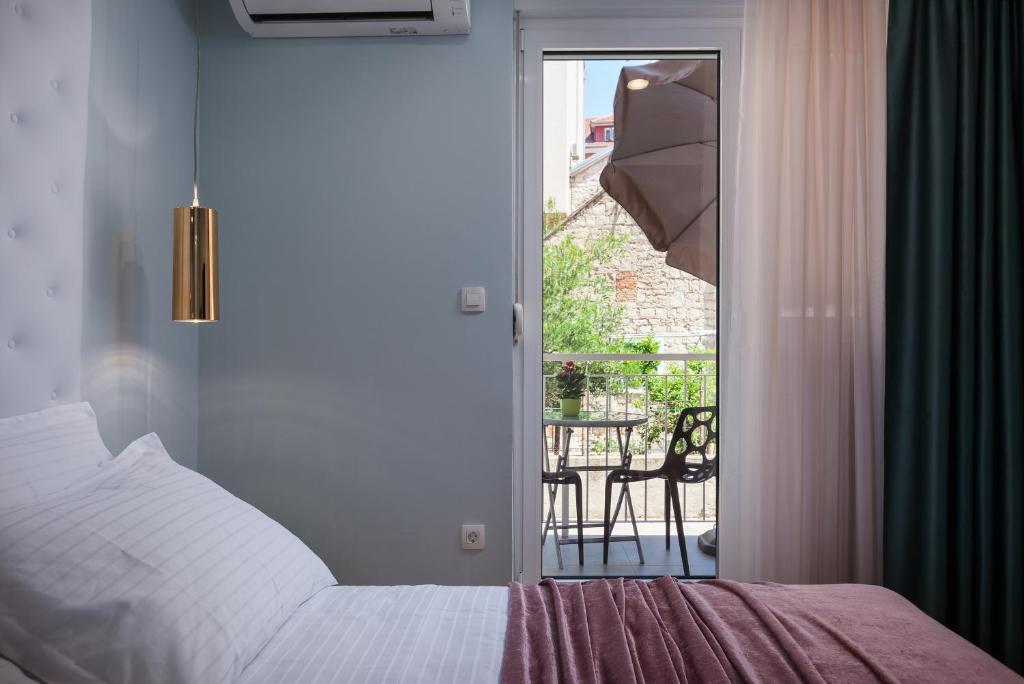 Postel nebo postele na pokoji v ubytování Rooms Albachiara