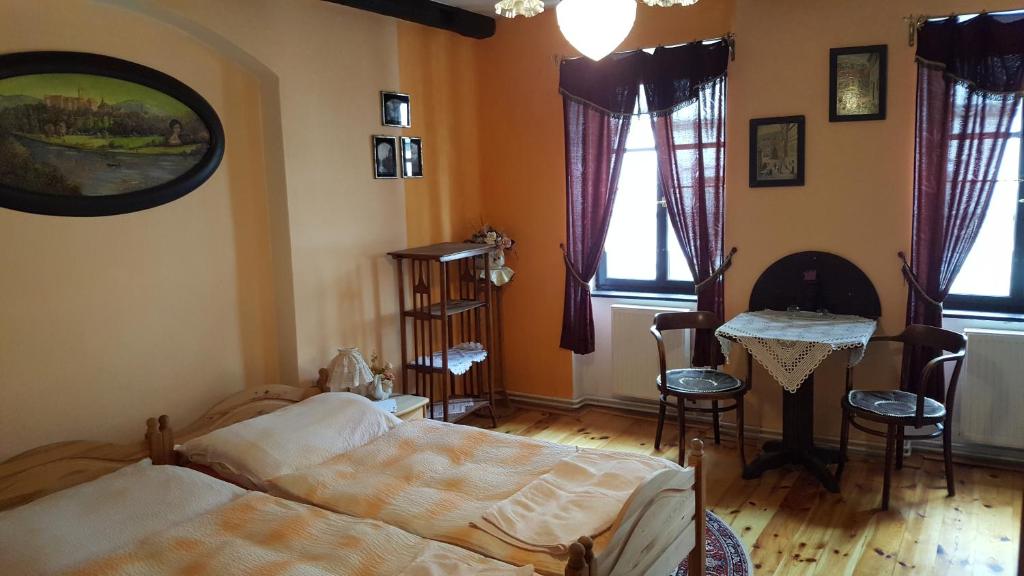 Postel nebo postele na pokoji v ubytování Penzion U Fridy