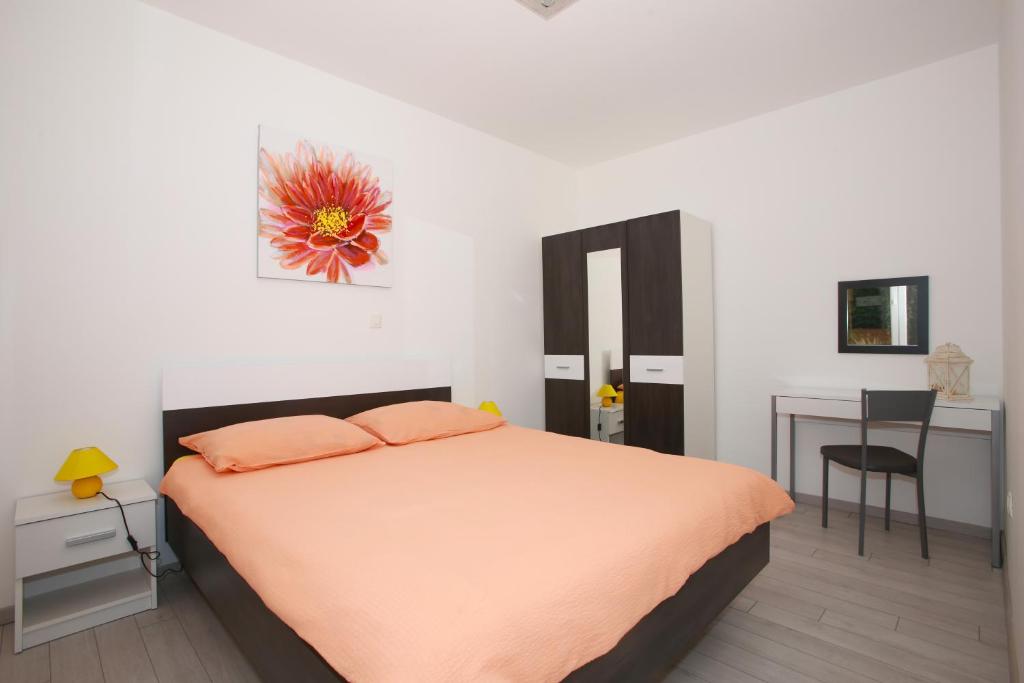 Postel nebo postele na pokoji v ubytování Apartman Carmen Volosko