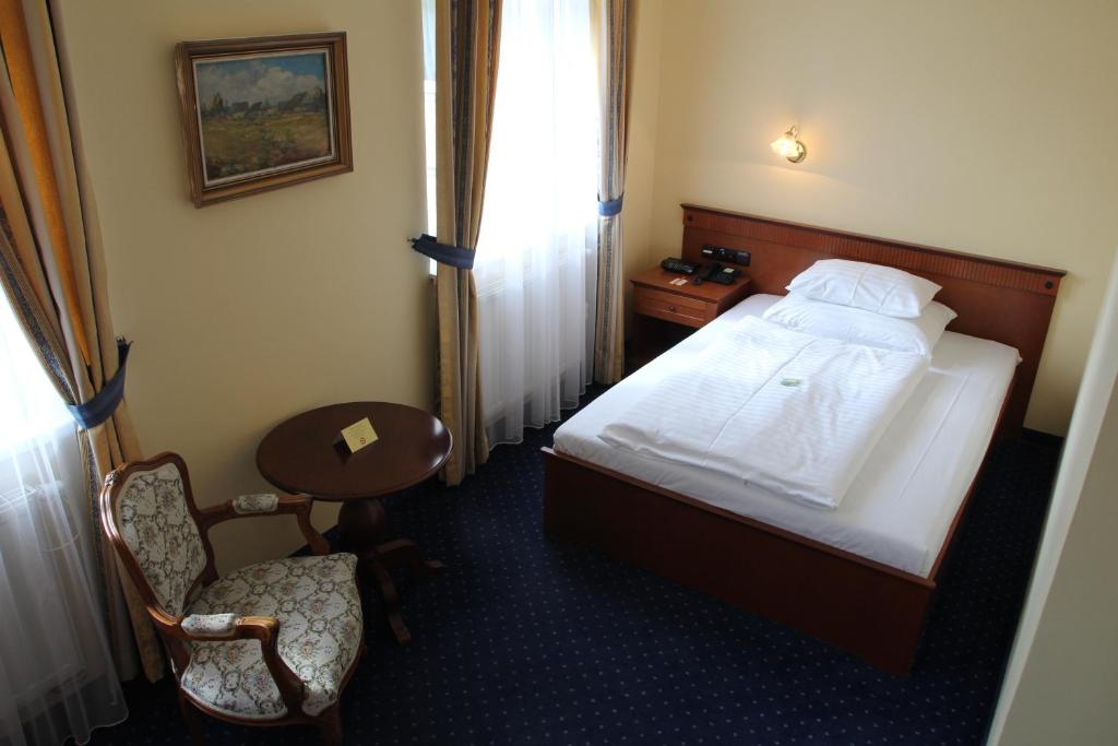 Postel nebo postele na pokoji v ubytování Parkhotel Richmond