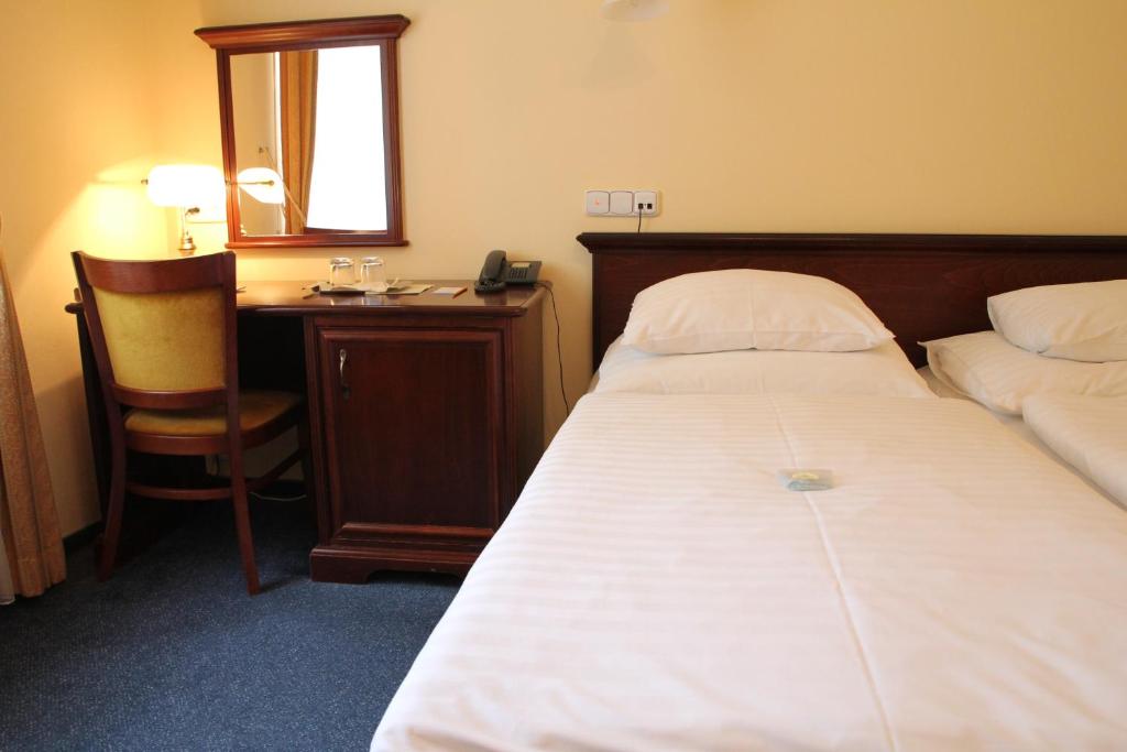 Postel nebo postele na pokoji v ubytování Parkhotel Richmond