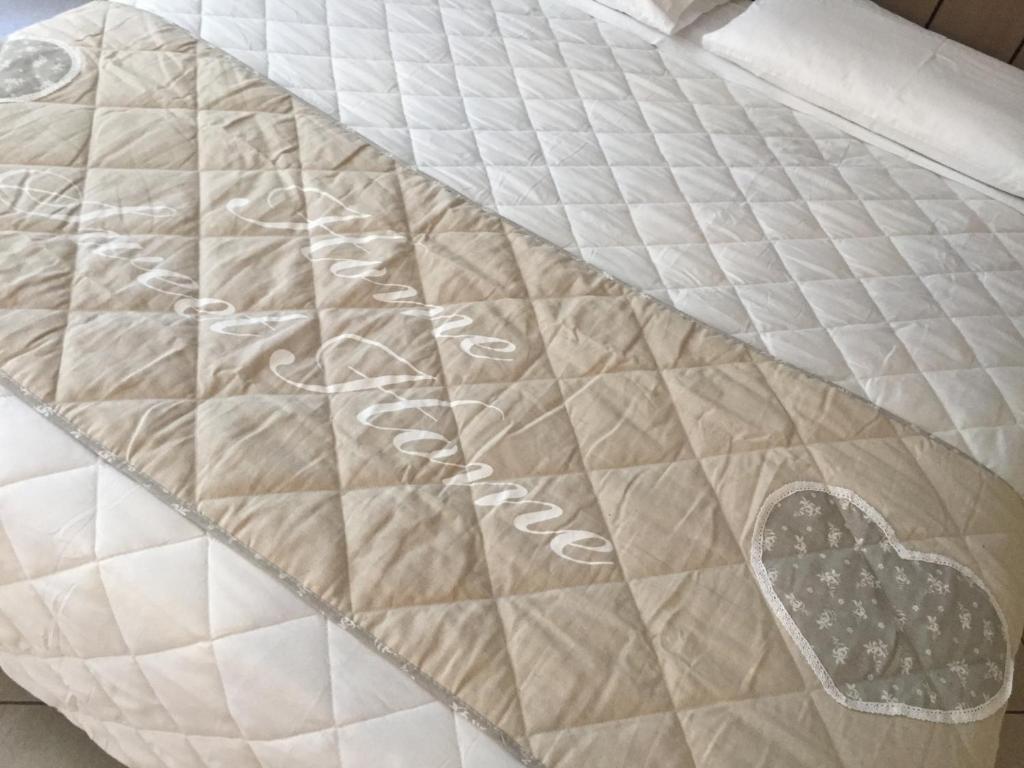 a bed with a mattress with a heart on it at ReArduinoIvrea in Ivrea