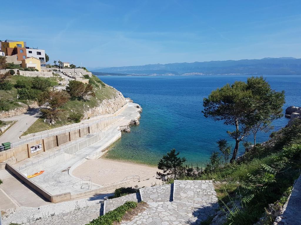 a scenic view of a beach with a view of the ocean at Hotel Argentum in Vrbnik