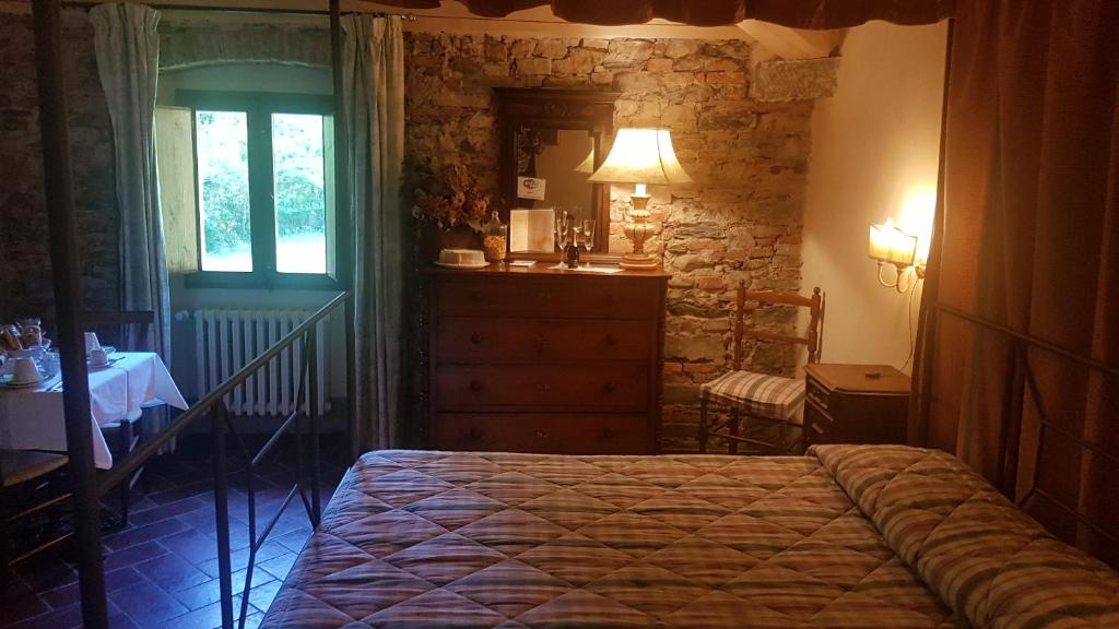Łóżko lub łóżka w pokoju w obiekcie Locanda Di Alberi