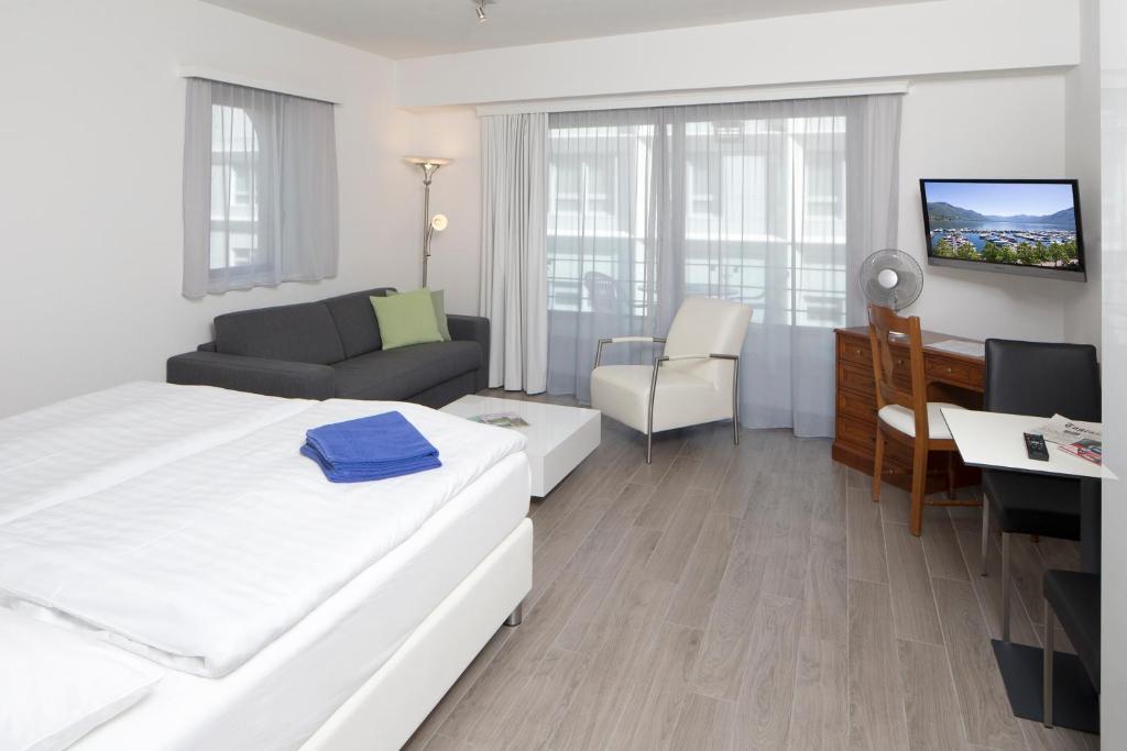 Postel nebo postele na pokoji v ubytování Aparthotel Al Lago