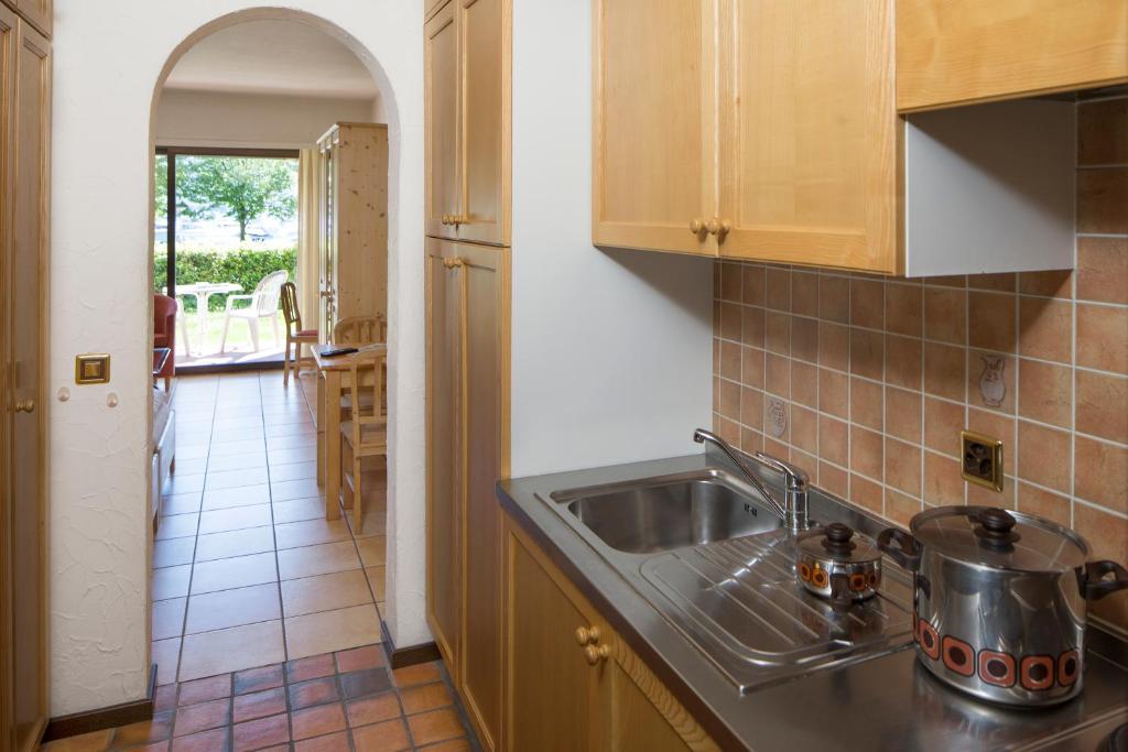Kuchyň nebo kuchyňský kout v ubytování Aparthotel Al Lago