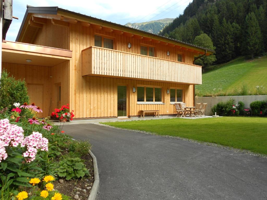 a house with a pathway leading to it at Ferienhaus Pfeifer in Gaschurn