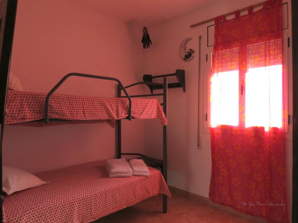 A bed or beds in a room at La Casa de la Lluna