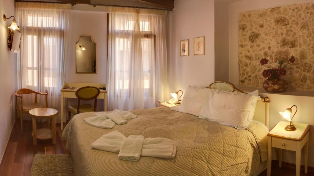 Postel nebo postele na pokoji v ubytování Palazzo Duca