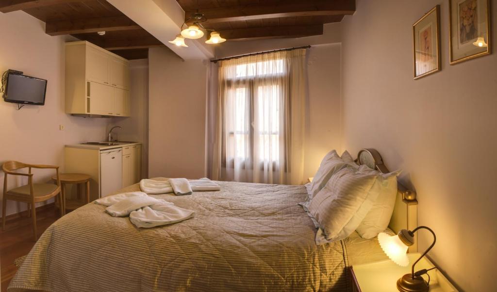 Postel nebo postele na pokoji v ubytování Palazzo Duca