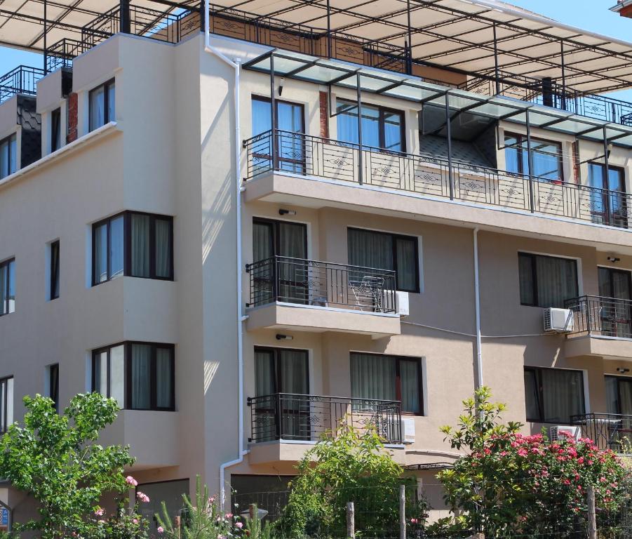 an external view of an apartment building at Flowers Apartments in Nesebar