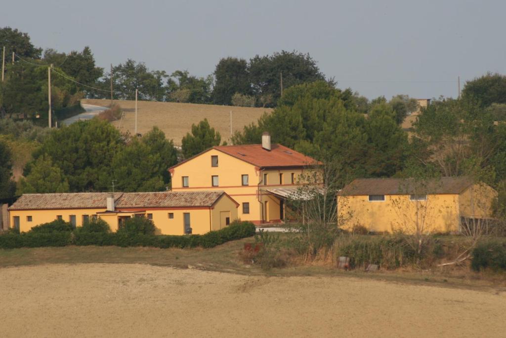 a group of houses on the side of a hill at Il Campetto Country House in Senigallia