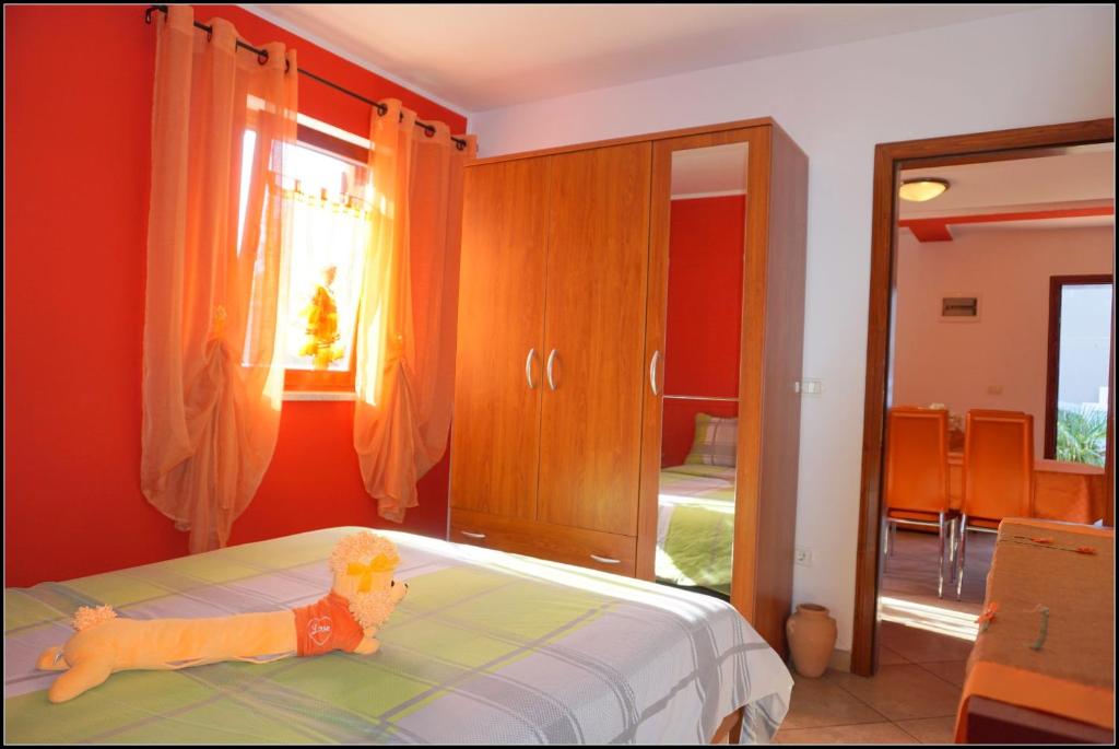 Postel nebo postele na pokoji v ubytování Apartments Nives NB