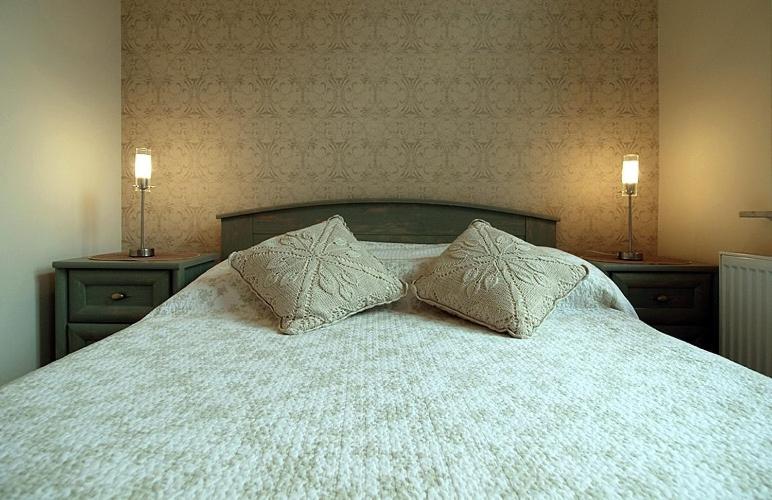 Postel nebo postele na pokoji v ubytování Apartamenty Julian