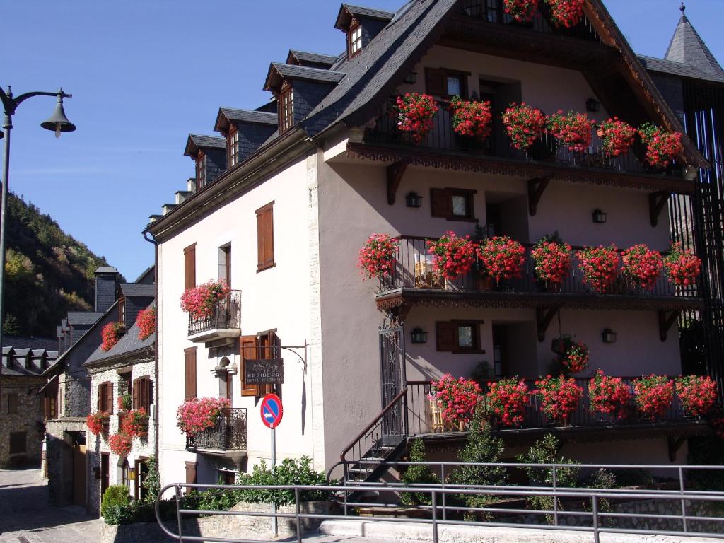 a building with flower boxes on the balconies at Besiberri in Arties