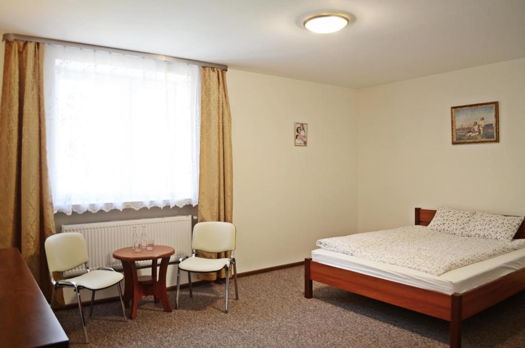 Łóżko lub łóżka w pokoju w obiekcie Willa Sailor Pabianice