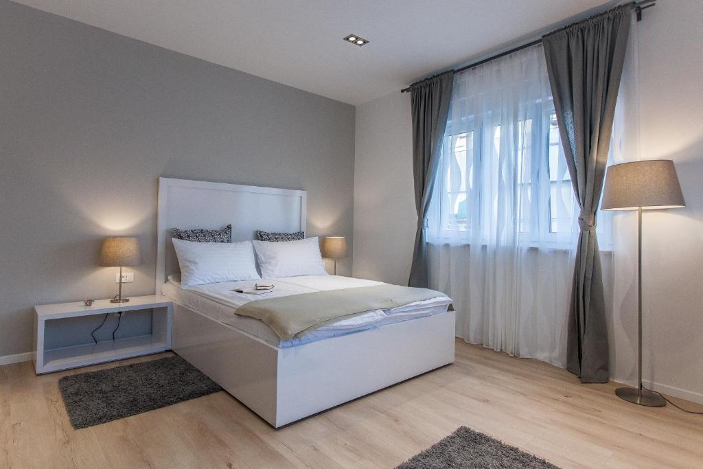 Posteľ alebo postele v izbe v ubytovaní Priuli Luxury Rooms