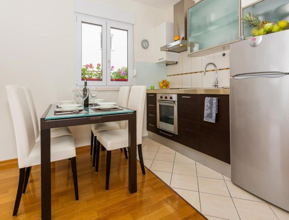 Kuchyň nebo kuchyňský kout v ubytování La Vita e Bella Apartment