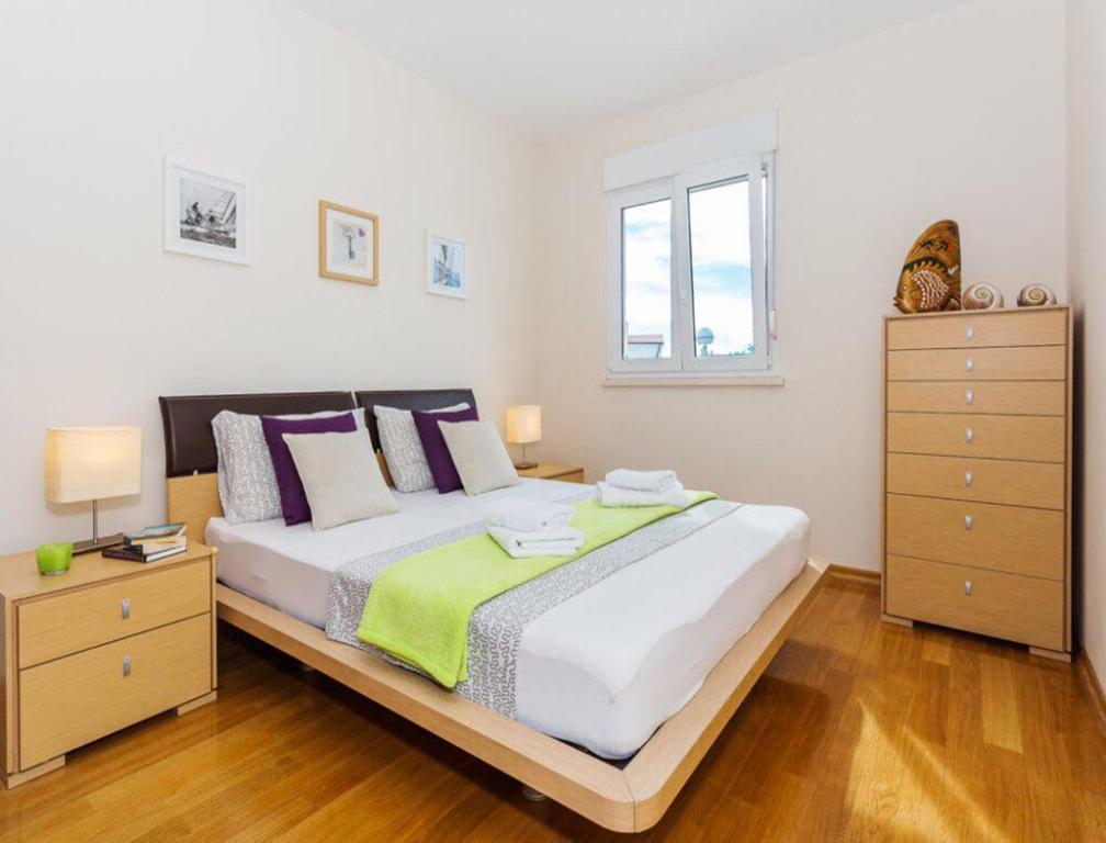 Postel nebo postele na pokoji v ubytování La Vita e Bella Apartment