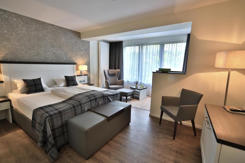 Postel nebo postele na pokoji v ubytování Landidyll Hotel zum Freden