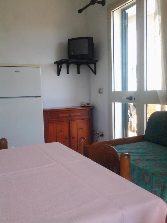 TV a/nebo společenská místnost v ubytování Hotel Rustichello