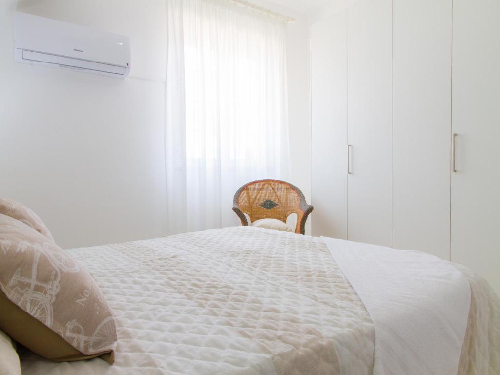 Łóżko lub łóżka w pokoju w obiekcie Gelso Bianco Apartments