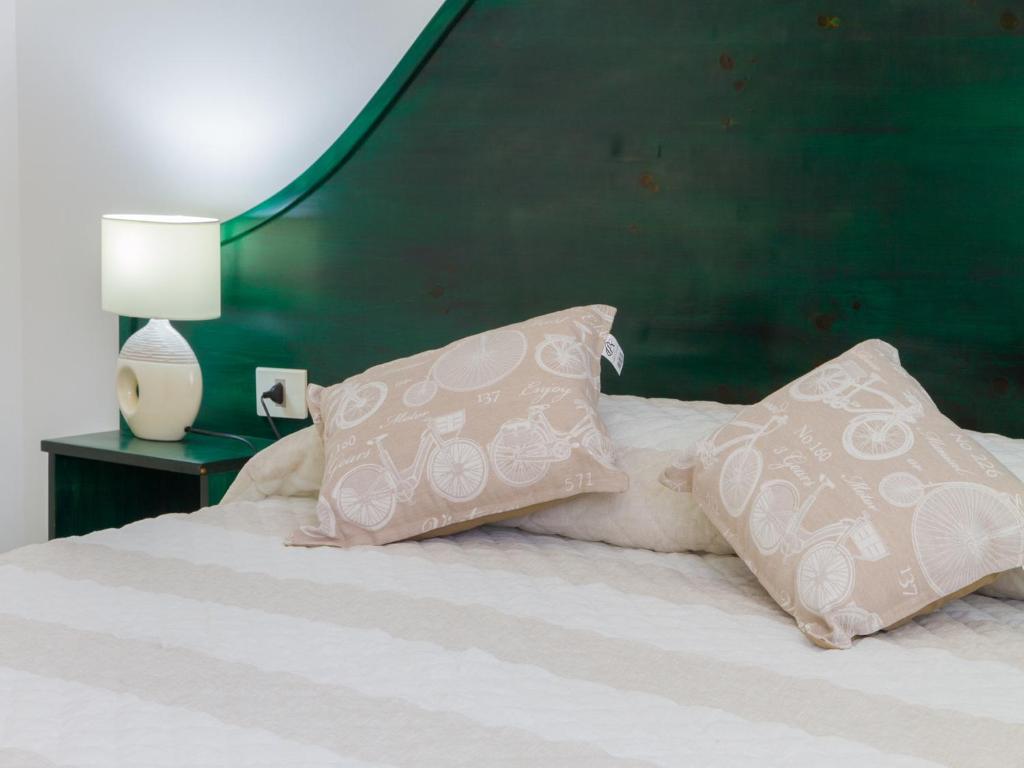 Łóżko lub łóżka w pokoju w obiekcie Gelso Bianco Apartments