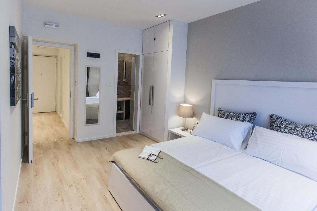 Posteľ alebo postele v izbe v ubytovaní Priuli Luxury Rooms