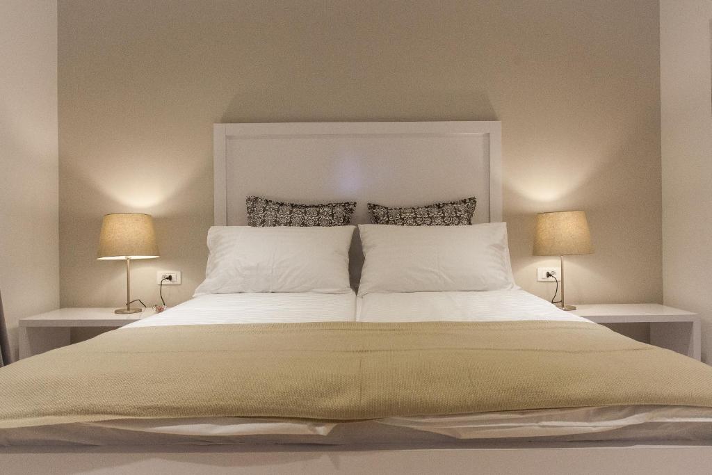 Posteľ alebo postele v izbe v ubytovaní Priuli Luxury Rooms