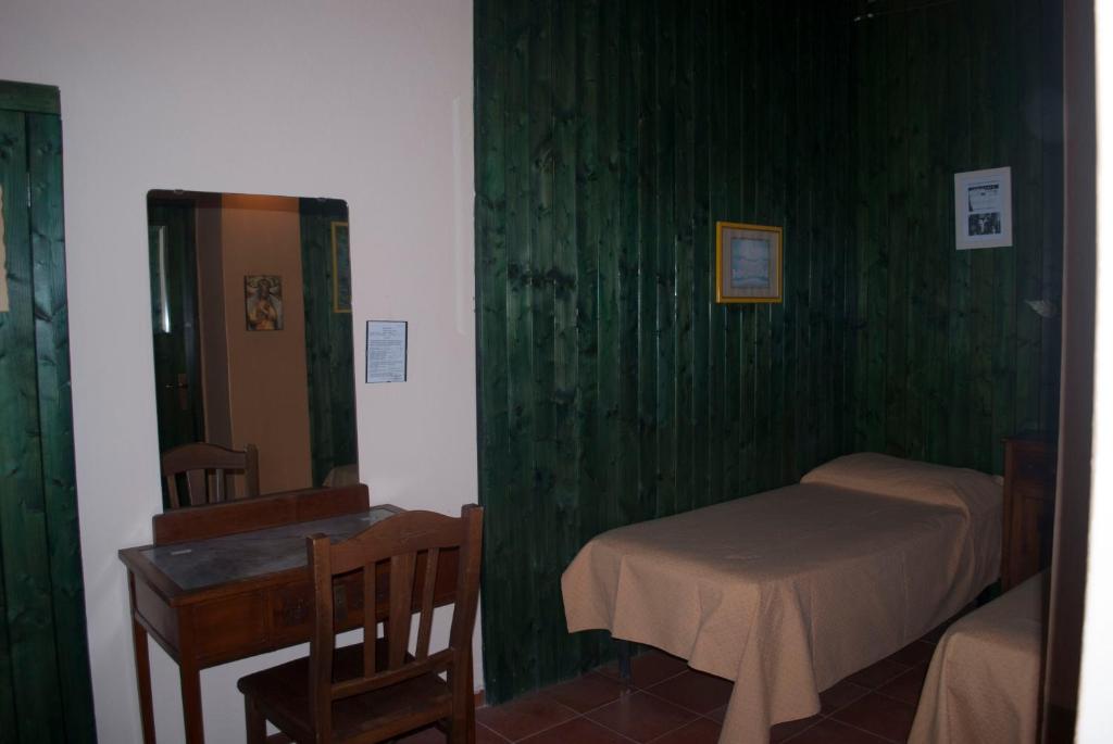 A bed or beds in a room at Agriturismo Fattoria di Grenne