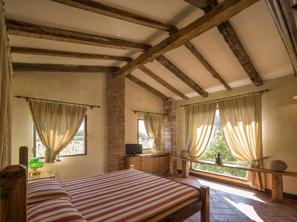 Tempat tidur dalam kamar di Resort La Ghiaia