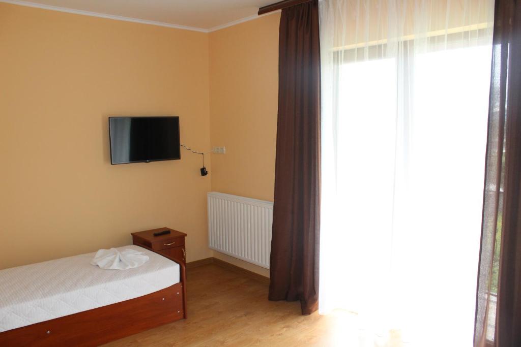 Postel nebo postele na pokoji v ubytování Sukhoviia
