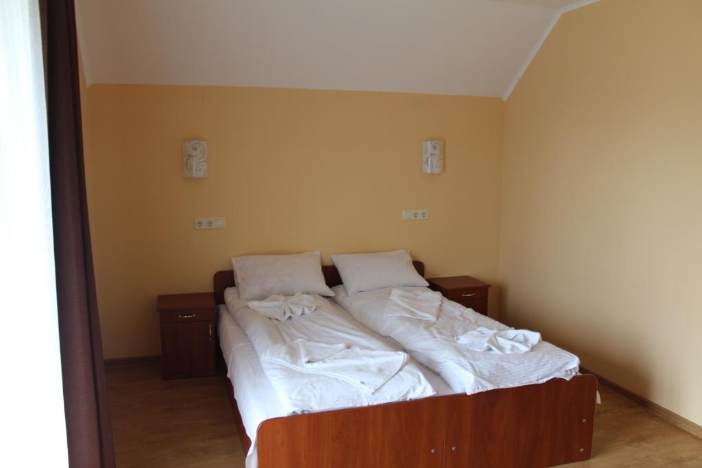 Postel nebo postele na pokoji v ubytování Sukhoviia