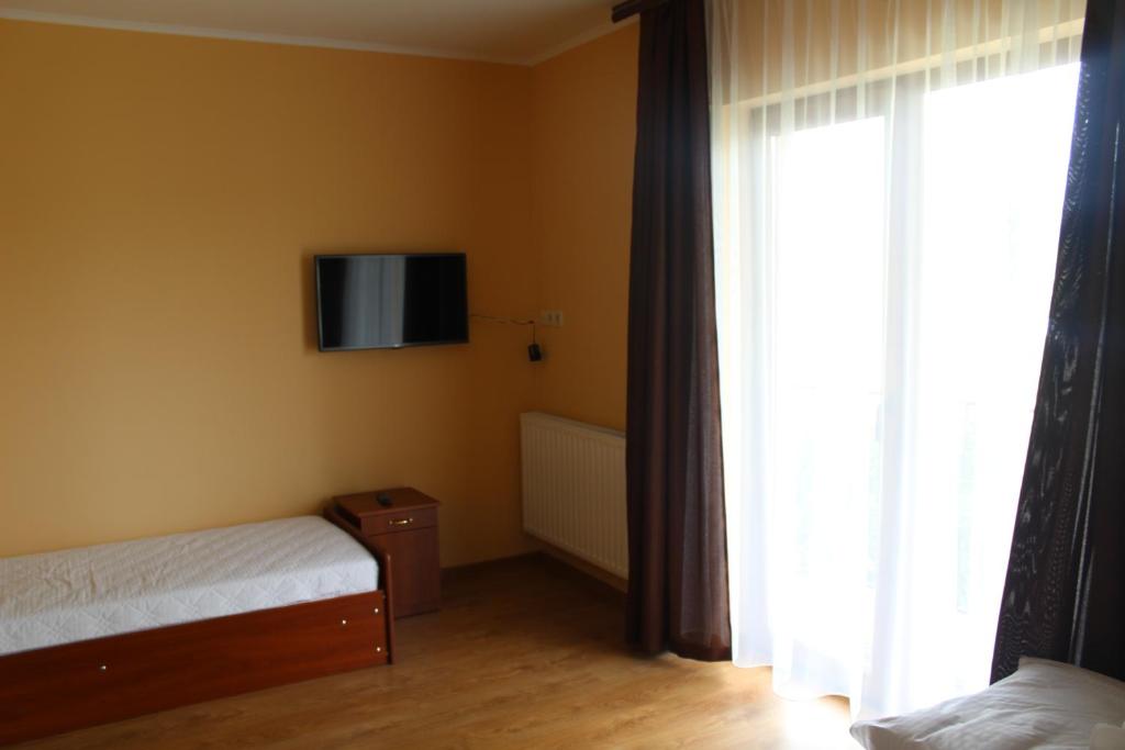 Postel nebo postele na pokoji v ubytování Sukhoviia