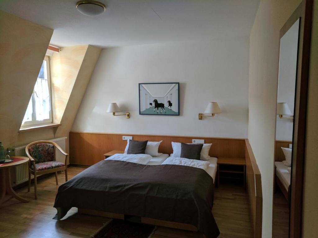 מיטה או מיטות בחדר ב-Steinhäuser Hof