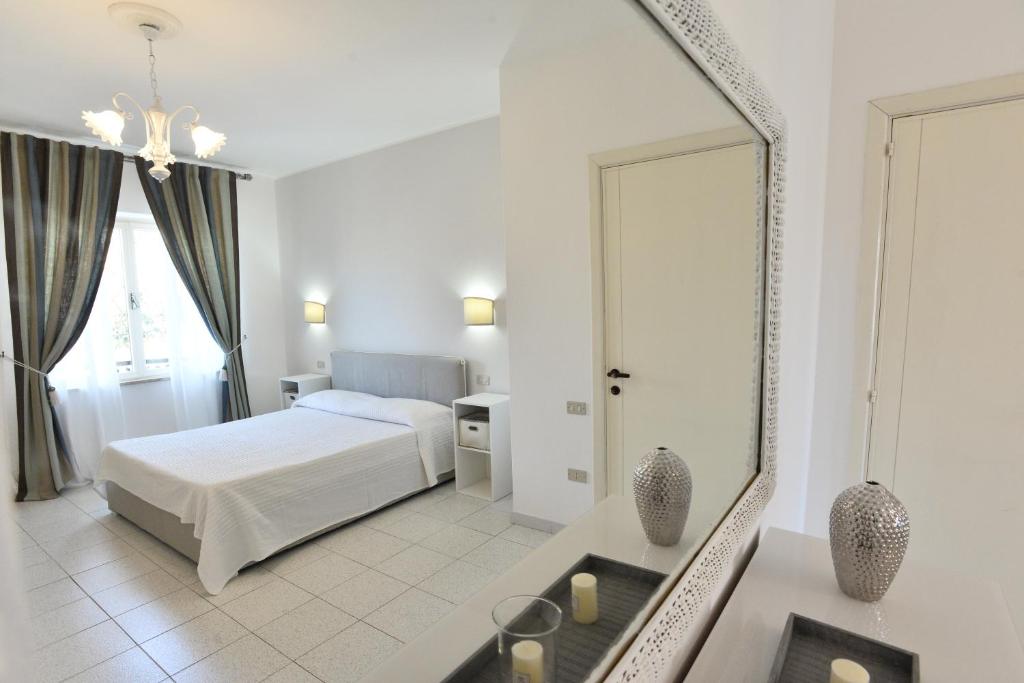 Posteľ alebo postele v izbe v ubytovaní Villa Elisabetta Apartments