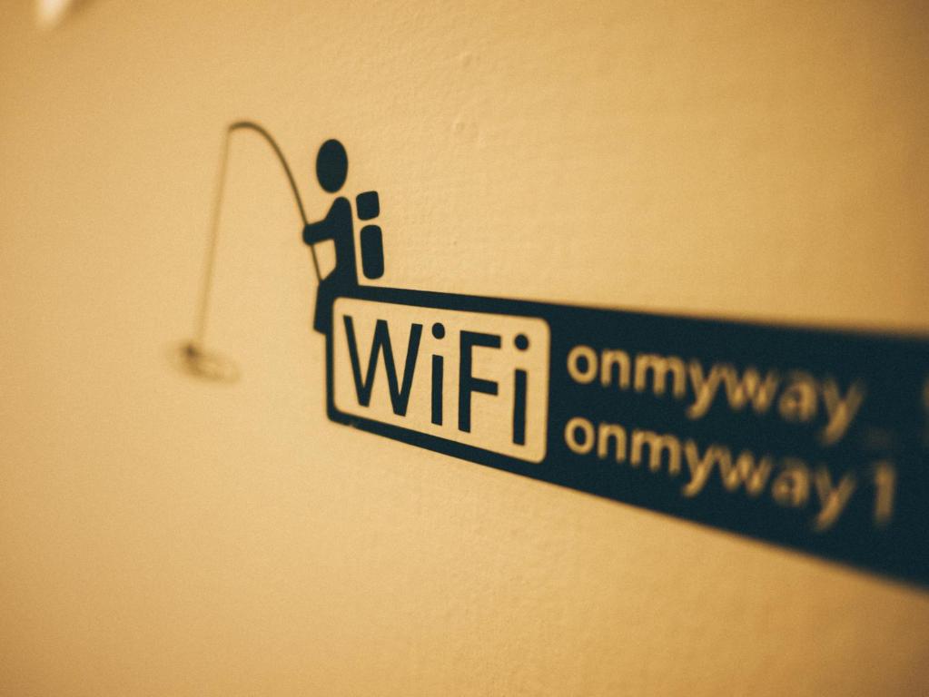a street sign that reads wii on the wall at On My Way - Taipei Hostel in Taipei