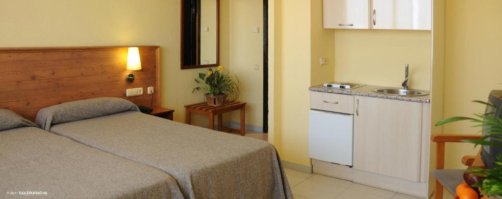 Postel nebo postele na pokoji v ubytování Hotel Flamero