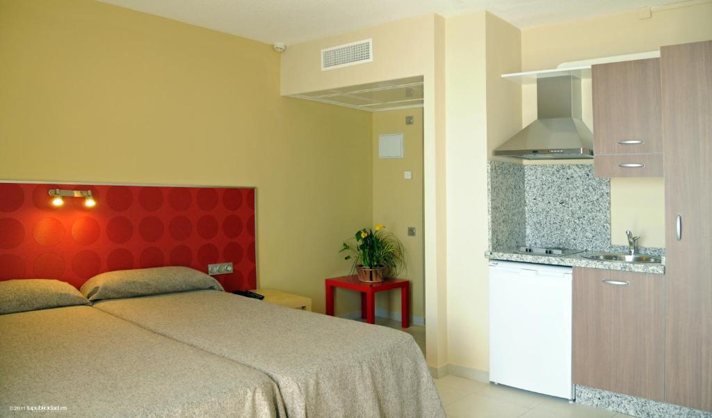 Postel nebo postele na pokoji v ubytování Hotel Flamero