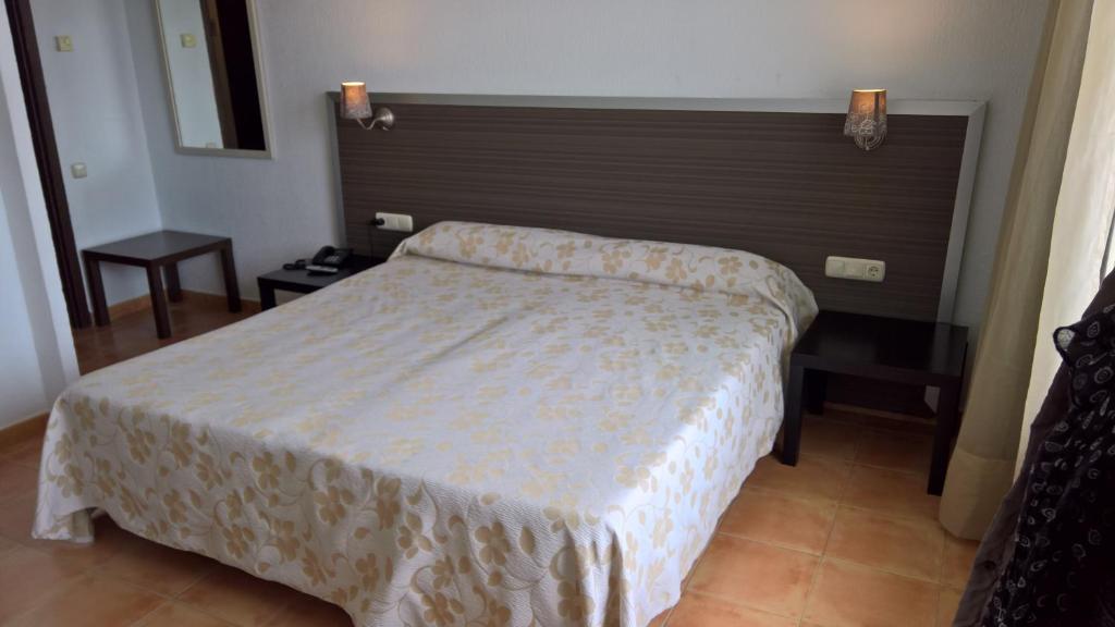 Postel nebo postele na pokoji v ubytování Hotel Flamero