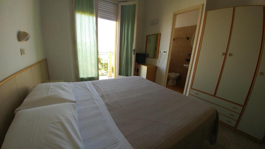 Postel nebo postele na pokoji v ubytování Hotel Capitol
