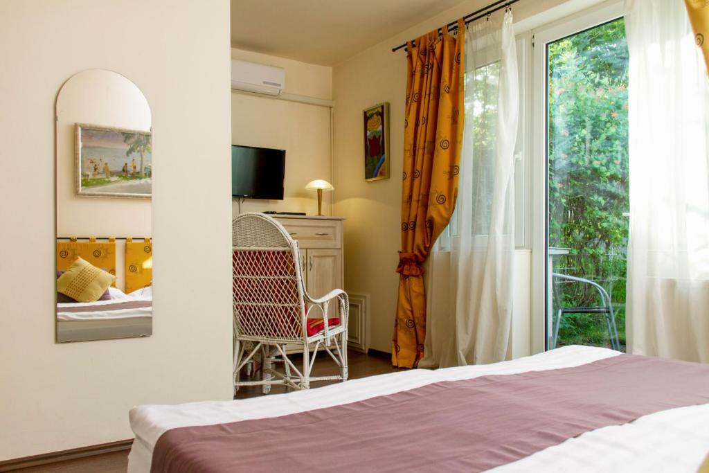 Postel nebo postele na pokoji v ubytování Albergo Giardino