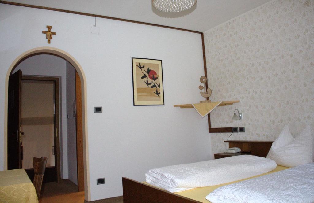 Postel nebo postele na pokoji v ubytování Hotel Bad Bergfall