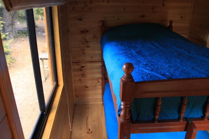 Postel nebo postele na pokoji v ubytování Refugio Altazor