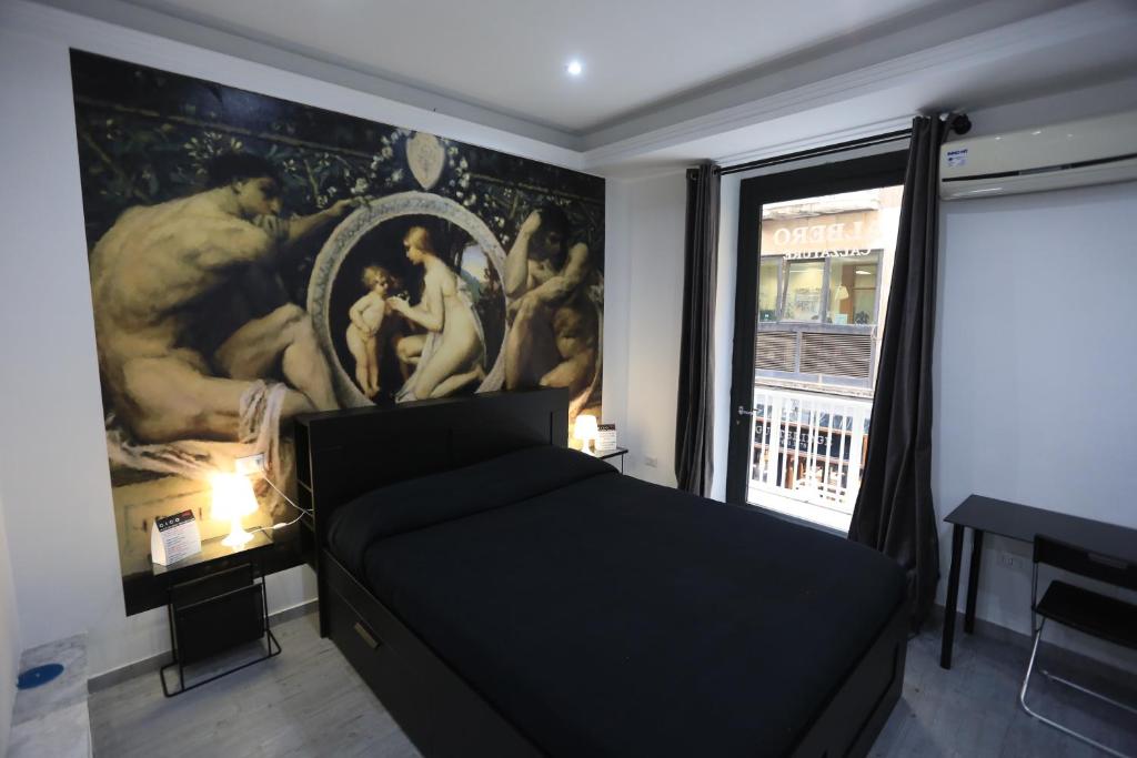 A bed or beds in a room at Cico B&B